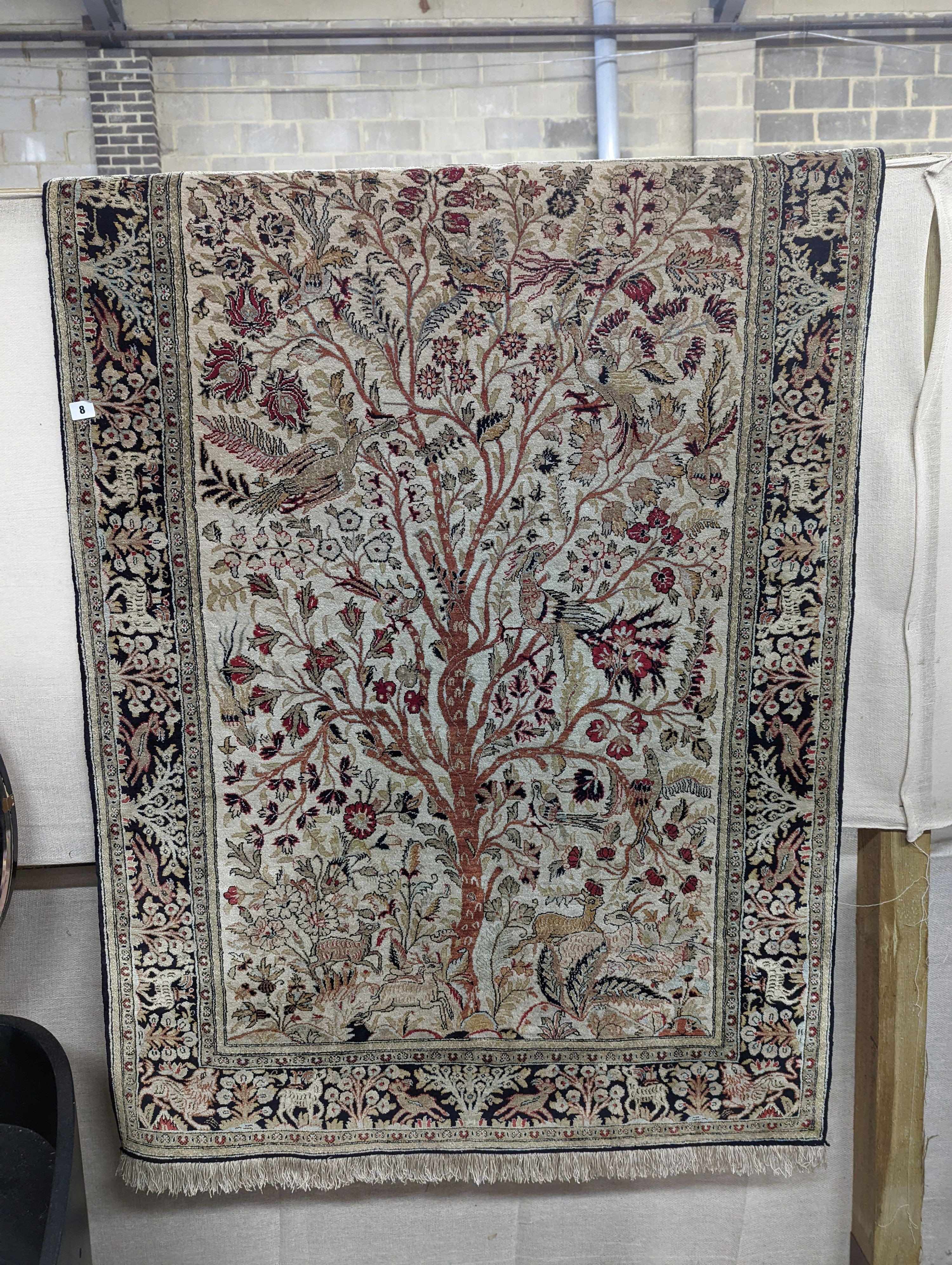 An Ispahan part silk tree of life ivory ground rug, 106 x 150cm